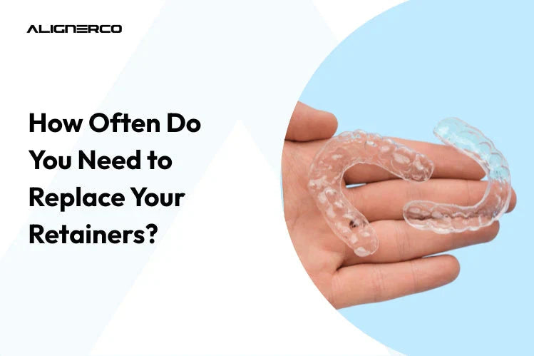 Hand holding transparent plastic teeth retainers for post-orthodontic care